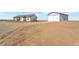 Expansive property with white house and barn on large lot at 60600 E 56Th Ave, Strasburg, CO 80136