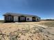 New construction home with modern design, dark accents, and a concrete walkway on a large lot at 60600 E 56Th Ave, Strasburg, CO 80136