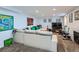 Finished basement features a large sectional couch and a flat-screen TV for entertainment at 2060 Ash St, Denver, CO 80207