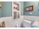 Cozy bathroom with built in storage shelves and fixtures at 2060 Ash St, Denver, CO 80207
