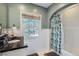 Classic bathroom featuring a vanity with black countertop and a shower-tub combo at 2060 Ash St, Denver, CO 80207