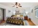 Bright bedroom with ceiling fan, hardwood floors, and patterned bedding at 2060 Ash St, Denver, CO 80207