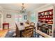 Formal dining room with chandelier and hardwood floors at 2060 Ash St, Denver, CO 80207