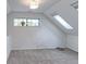 Finished attic area with skylights and a window, offering ample natural light at 4877 Darwin Ct, Boulder, CO 80301