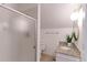 Bathroom featuring a shower with glass doors and granite vanity at 4877 Darwin Ct, Boulder, CO 80301