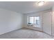 Bright bedroom featuring a window seat and neutral carpeting at 4877 Darwin Ct, Boulder, CO 80301