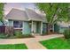 Charming home with a covered porch, landscaped front yard, and inviting curb appeal at 4877 Darwin Ct, Boulder, CO 80301