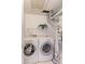 Convenient laundry room with washer, dryer, and storage shelving at 4877 Darwin Ct, Boulder, CO 80301