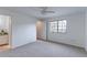Spacious main bedroom with neutral carpet, ceiling fan, and an ensuite bathroom at 4877 Darwin Ct, Boulder, CO 80301