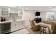 Finished basement with wet bar, wine fridge, and seating area perfect for entertaining at 9705 Westbury Cir, Highlands Ranch, CO 80129