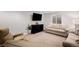 Cozy finished basement boasts a comfortable seating area and plenty of natural light at 9705 Westbury Cir, Highlands Ranch, CO 80129