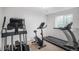 Home gym with an elliptical, treadmill and stationary bike for your fitness goals at 9705 Westbury Cir, Highlands Ranch, CO 80129