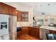 Well-equipped kitchen boasts stainless steel appliances and granite countertops at 9705 Westbury Cir, Highlands Ranch, CO 80129