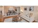 Open-concept living and dining area with hardwood floors and neutral decor at 9705 Westbury Cir, Highlands Ranch, CO 80129