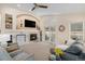 Bright living room featuring a fireplace, built-in shelves, and comfortable seating at 9705 Westbury Cir, Highlands Ranch, CO 80129