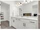 Bathroom offers double sinks, modern lighting, and a closet at 4706 Mesa Top Dr, Monument, CO 80132