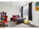 Fun bedroom with arcade game, comfortable bed, and playful decor at 4706 Mesa Top Dr, Monument, CO 80132