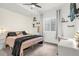 Serene bedroom with decorative string lights, comfortable bed, and a dedicated workspace at 4706 Mesa Top Dr, Monument, CO 80132