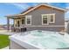 Luxurious hot tub with bubbling water, set in a beautifully landscaped backyard at 4706 Mesa Top Dr, Monument, CO 80132