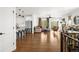 Open-concept living space boasting hardwood floors, a fireplace, and seamless flow into the kitchen at 4706 Mesa Top Dr, Monument, CO 80132