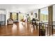 Bright, open living area with hardwood flooring, fireplace, and ample natural light through large windows at 4706 Mesa Top Dr, Monument, CO 80132
