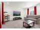 Cozy living room with large TV, comfortable seating, and a popcorn machine at 4706 Mesa Top Dr, Monument, CO 80132