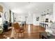 Spacious open floor plan with hardwood floors connecting living, dining, and kitchen areas at 4706 Mesa Top Dr, Monument, CO 80132
