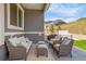 Comfortable covered patio with stylish furniture, perfect for outdoor relaxation and entertaining at 4706 Mesa Top Dr, Monument, CO 80132
