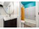 Well-lit bathroom with a modern vanity, sleek fixtures, and a tub with colorful accents at 7937 Chase Cir # 176, Arvada, CO 80003