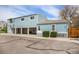 Rear exterior view of blue home showing carports and a well-maintained backyard at 7937 Chase Cir # 176, Arvada, CO 80003