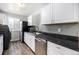 Charming kitchen with stainless steel appliances and white cabinetry at 7937 Chase Cir # 176, Arvada, CO 80003
