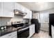 Well-equipped kitchen features stainless steel appliances, modern fixtures, and ample counter space at 7937 Chase Cir # 176, Arvada, CO 80003
