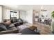 Open concept living room featuring a cozy sectional sofa and a dining area with modern decor at 7937 Chase Cir # 176, Arvada, CO 80003