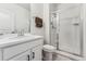 Bathroom with a tiled shower, vanity with sink, toilet, and modern fixtures at 2548 Horsehound Pl, Castle Rock, CO 80104