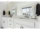 Elegant bathroom featuring double sinks, ample counter space, and modern design elements at 2548 Horsehound Pl, Castle Rock, CO 80104