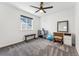 Bedroom featuring carpet, a window, ceiling fan, and gym equipment at 2548 Horsehound Pl, Castle Rock, CO 80104