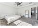 Bright bedroom with neutral carpet, a ceiling fan, and modern decor creates a cozy and inviting atmosphere at 2548 Horsehound Pl, Castle Rock, CO 80104