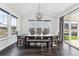 Dining room with large windows and sliding glass door that bring in natural light at 2548 Horsehound Pl, Castle Rock, CO 80104