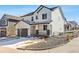 Beautiful two-story house featuring a covered porch and a well-maintained front yard in winter at 2548 Horsehound Pl, Castle Rock, CO 80104