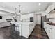 Beautiful open kitchen with large center island and views into the living room at 2548 Horsehound Pl, Castle Rock, CO 80104