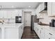 Bright kitchen boasts white cabinetry, stainless appliances, and a functional layout perfect for cooking and entertaining at 2548 Horsehound Pl, Castle Rock, CO 80104