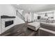 Stylish living room showcasing a fireplace, staircase, and open layout to kitchen at 2548 Horsehound Pl, Castle Rock, CO 80104