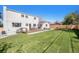 Spacious backyard features a large lawn, deck, and inviting patio area at 5872 Taft St, Arvada, CO 80004