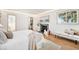 Comfortable bedroom featuring a fireplace, natural light, and a walk-in closet at 5872 Taft St, Arvada, CO 80004