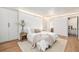 Bright bedroom with clean white walls, hardwood floors, and a spacious closet at 5872 Taft St, Arvada, CO 80004