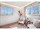 Light-filled sitting room with comfortable seating and windows with views of the greenery outside at 5872 Taft St, Arvada, CO 80004