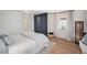 Cozy bedroom with hardwood floors, a modern closet, and a serene, neutral color palette at 5872 Taft St, Arvada, CO 80004
