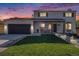 Charming home with a well-manicured lawn, inviting porch, and modern curb appeal at 5872 Taft St, Arvada, CO 80004