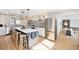 Stylish kitchen with an island, stainless steel appliances, and abundant natural light at 5872 Taft St, Arvada, CO 80004