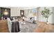 Comfortable living area features a modern fireplace, plush seating, and a large window for plenty of light at 5872 Taft St, Arvada, CO 80004